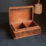 Wooden box for personalized jewellery storage with secret slider-