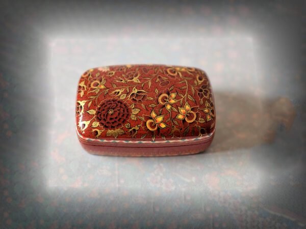 Red floral jewelry box as engagement ring