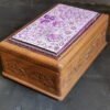Wooden box for personalized jewellery storage with secret slider-
