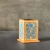 Kashmiri Pen Holder; kashmir paper mache ornaments ,Looking for a unique and stylish way to organize your desk? Look no further! Our hand-painted Kashmiri paper mache pen holder is the perfect solution. Standing at 5 inches in height, this square-shaped pen holder is not only functional but also a piece of art.