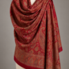 Red jamawar bridal shawl draped on a mannequin