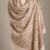 Ivory sozni bridal pashmina stole draped on a mannequin