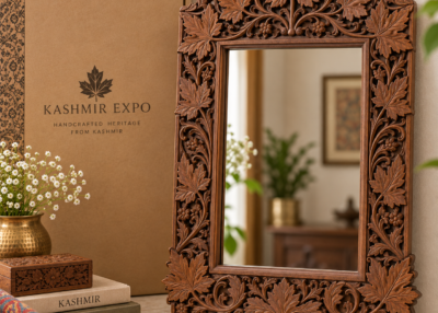 Hand-carved walnut mirror frame with deep-relief chinar motif