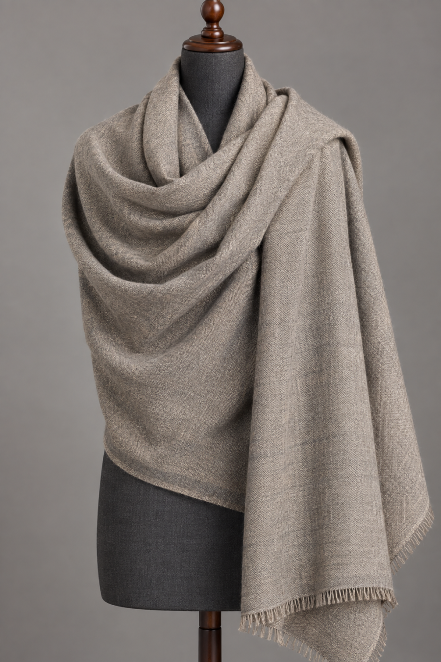 Men's natural grey wool lohi draped on a mannequin