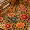 Close-up of hand-painted floral design on tray