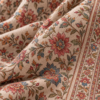 Close-up of floral sozni embroidery on wool shawl