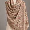 Sozni floral embroidered shawl draped on a mannequin