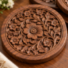 Close-up of hand-carved floral pattern on walnut coaster