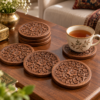 Carved walnut wood coasters on a tea table